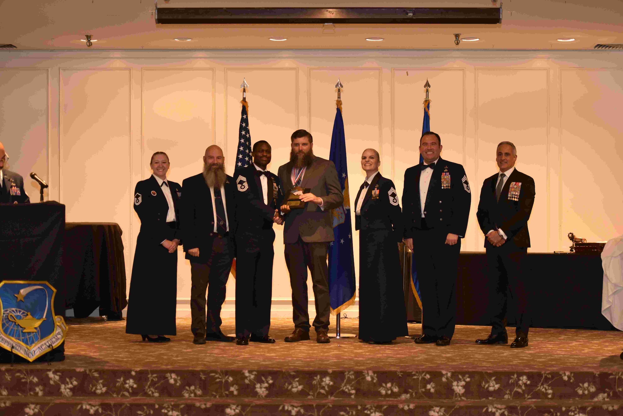 Braddon Kolafa, 2nd Civil Engineer Squadron structures foreman, accepts a distinguished honor graduate award during his noncommissioned officer academy graduation at Sheppard Air Force Base, Texas, April 2025. (U.S. Air Force courtesy photo)