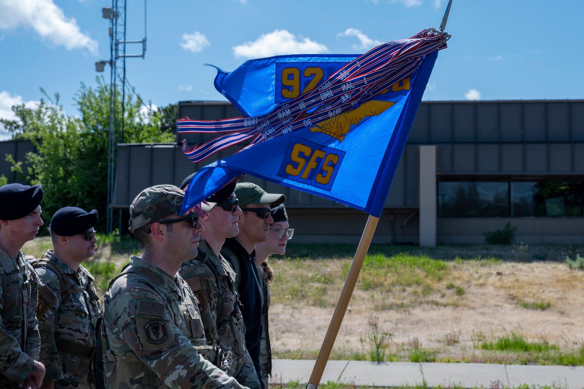 Members assigned to the 92nd Air Refueling Wing stand in formation during a Police Week Memorial Ruck at Fairchild Air Force Base, Washington, May 12, 2025. This four-mile memorial ruck honored all the fallen defenders, law enforcement officers, and Office of Special Investigations officers. (U.S. Air Force photo by Airman 1st Class Samantha Thorn).