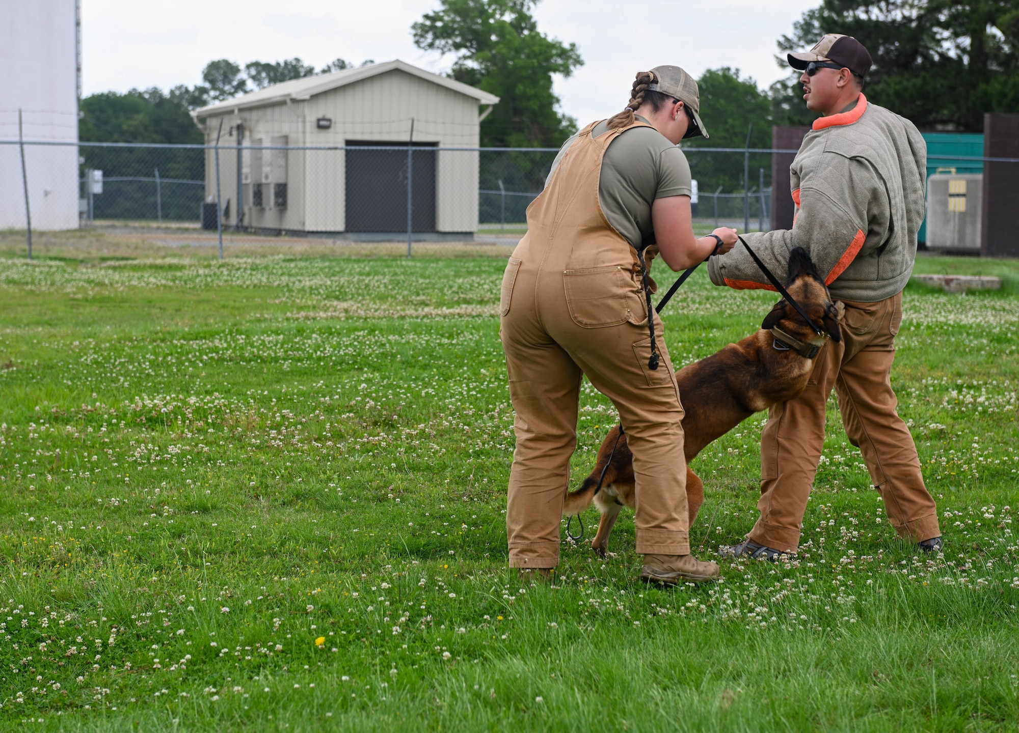 Airman demonstrate K-9 bite capabilities using bite suit.
