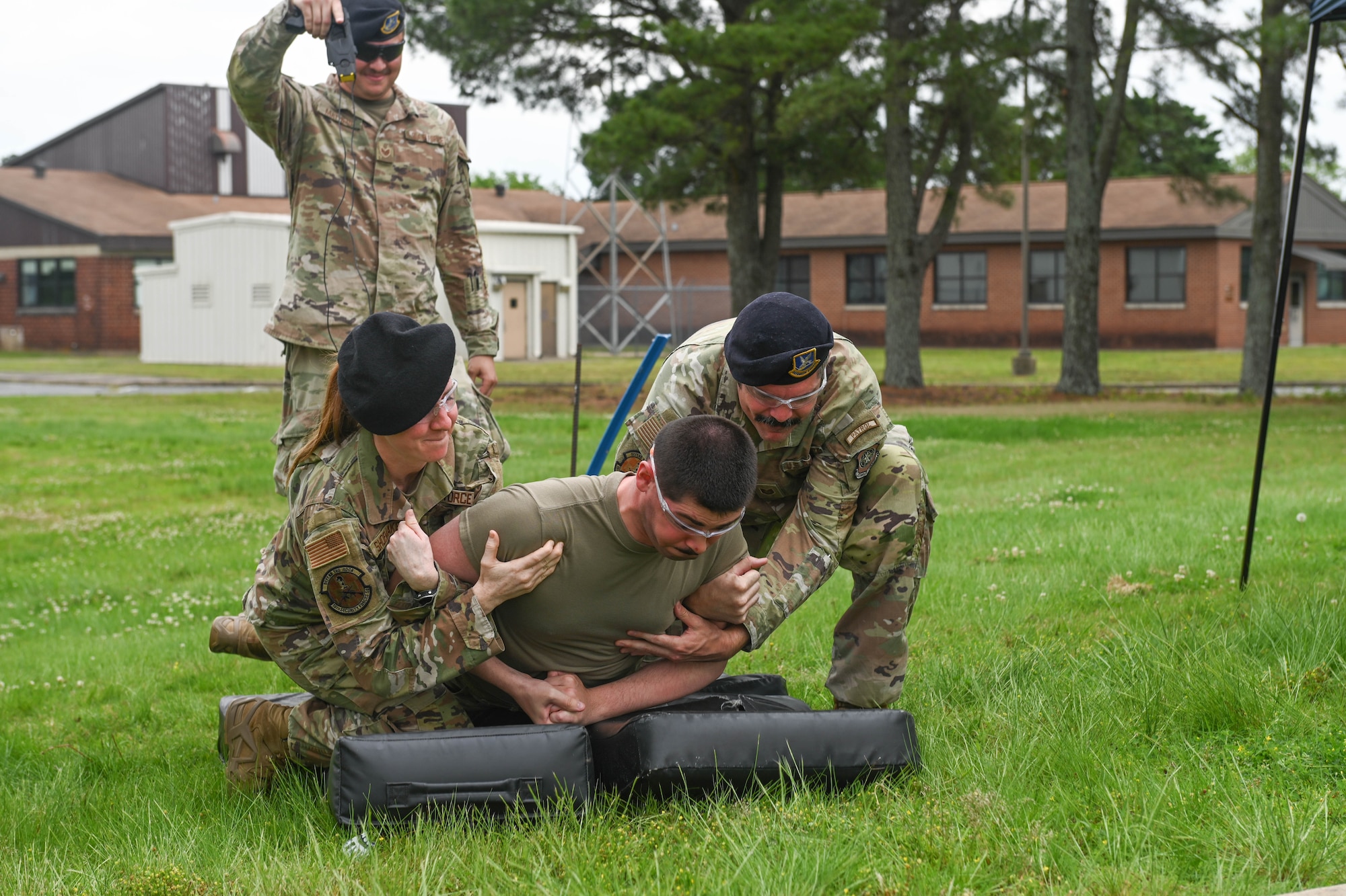 Airman showcases taser demonstration.