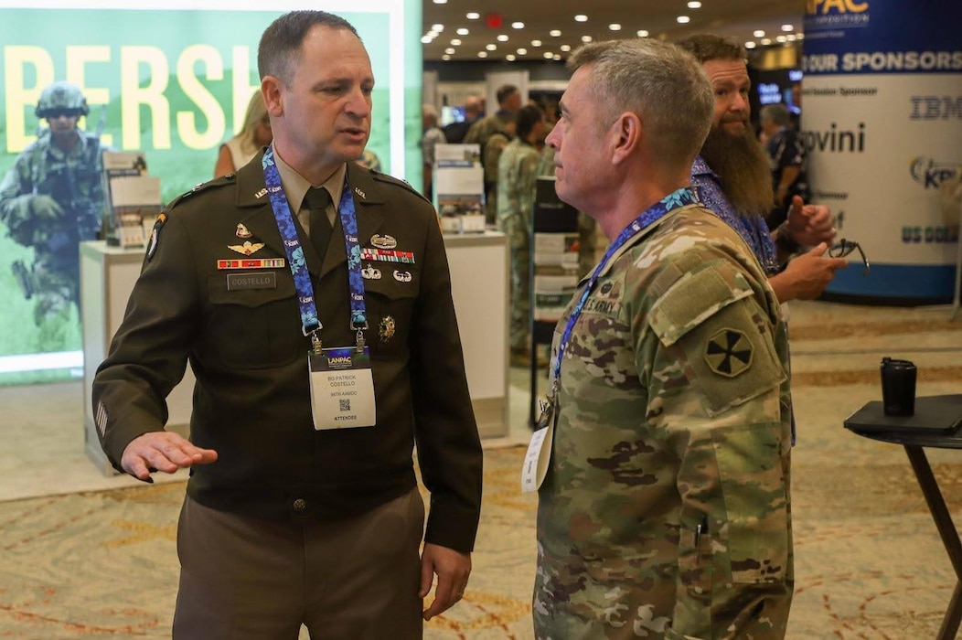 Brig. Gen. Sean Crockett, Eight Army acting commander (right), converses with Brig. Gen. Patrick Costello, 94th Army Air and Missile Defense Command commanding general, at LANPAC 2025 in Honolulu, Hawaii, May 13.