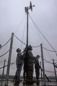 U.S. Marines with A Company and B Company, 7th Communication Battalion, III Marine Expeditionary Force Information Group, set up a Long-Range Radio System during Exercise Triad Thunder as part of Kaiju Rain on Camp Hansen, Okinawa, Japan, May 5, 2025.