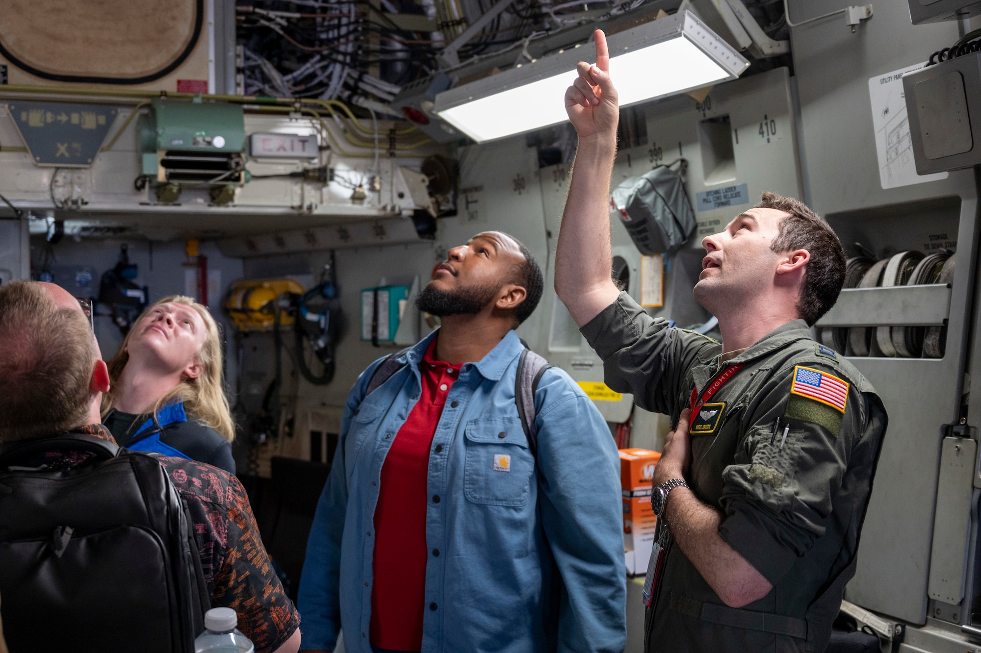 Sandia National Laboratories Weapon Intern Program participants listen to a U.S. Air Force Airman with the 62d Airlift Wing as he highlights C-17 Globemaster III components at Joint Base Lewis-McChord, Washington, May 7, 2025.