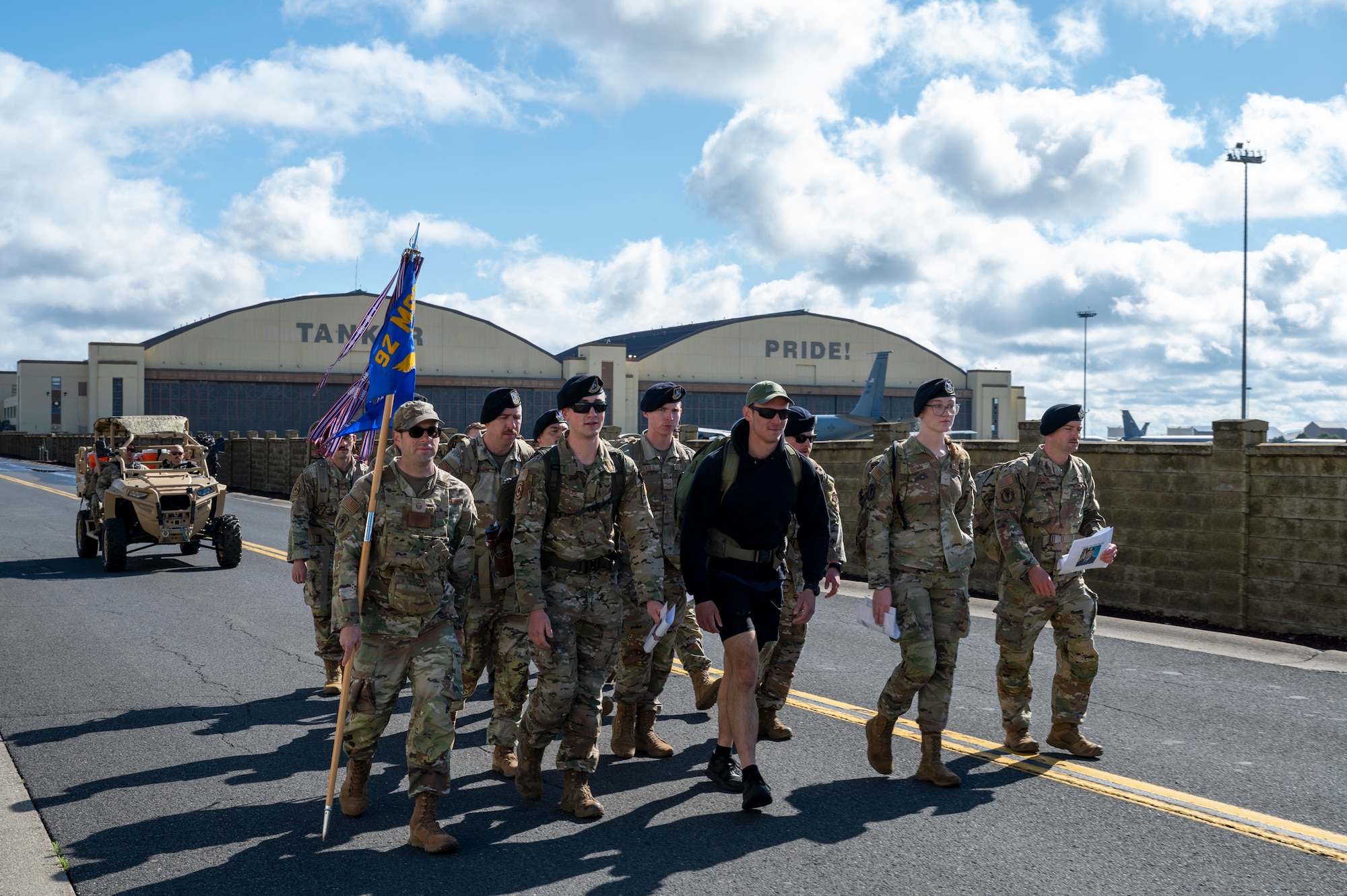 Members assigned to the 92nd Air Refueling Wing ruck during a Police Week Memorial Ruck at Fairchild Air Force Base, Washington, May 12, 2025. This four-mile memorial ruck honored the fallen defenders, law enforcement officers, and Office of Special Investigations officers. (U.S. Air Force photo by Airman 1st Class Samantha Thorn)