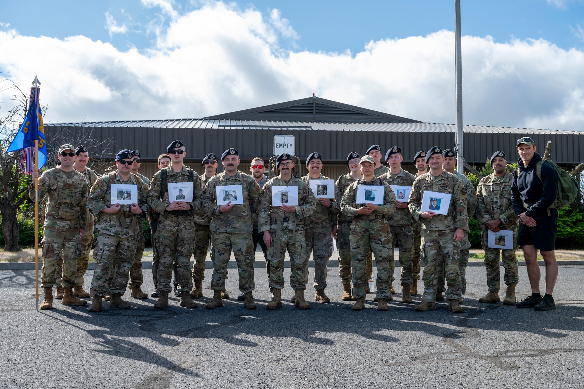 Members assigned to the 92nd Air Refueling Wing pose for a group photo during a Police Week Memorial Ruck at Fairchild Air Force Base, Washington, May 12, 2025. This four-mile memorial ruck honored the fallen defenders, law enforcement officers, and Office of Special Investigations officers. (U.S. Air Force photo by Airman 1st Class Samantha Thorn)