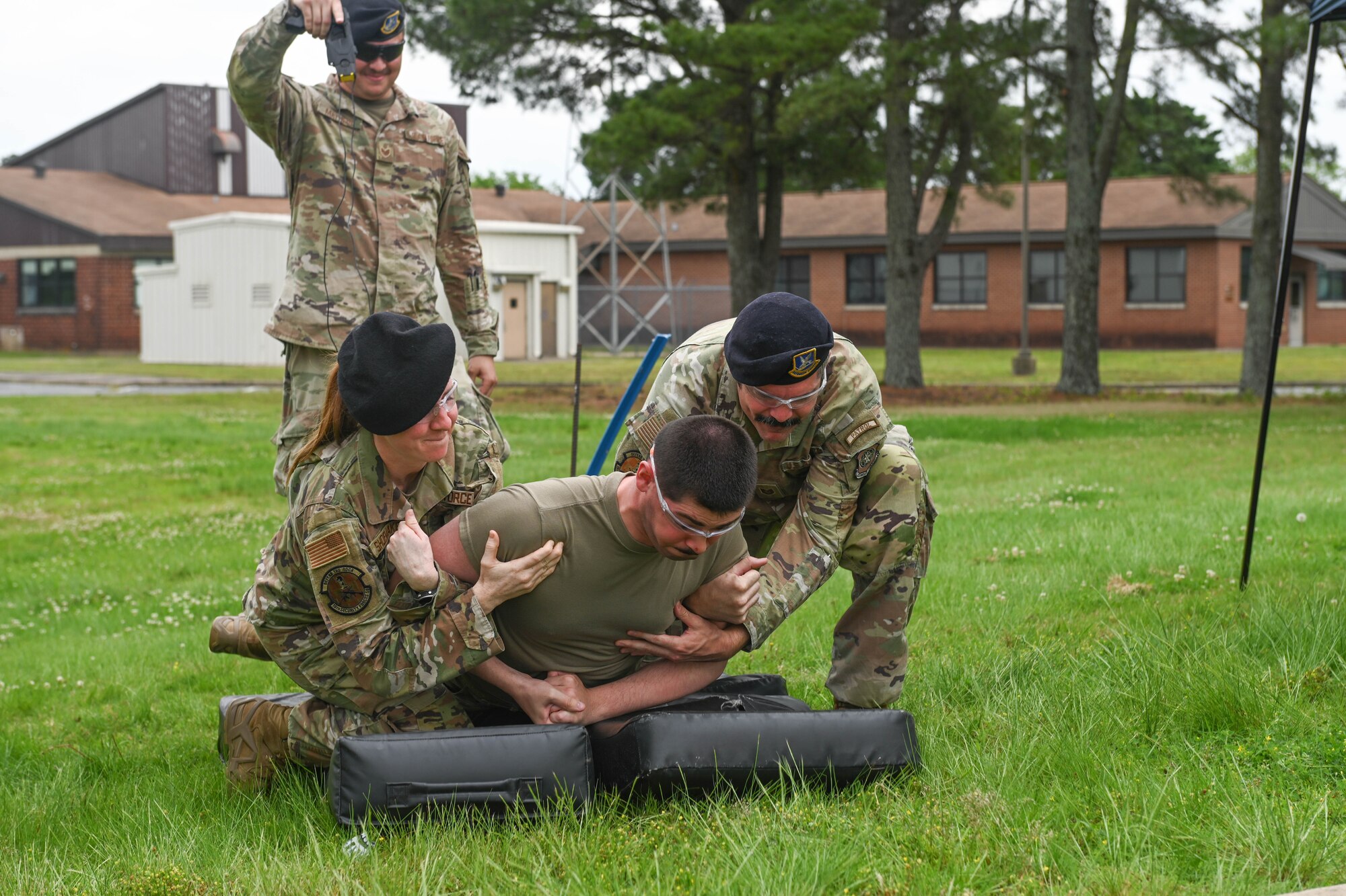 Airman showcases taser demonstration.