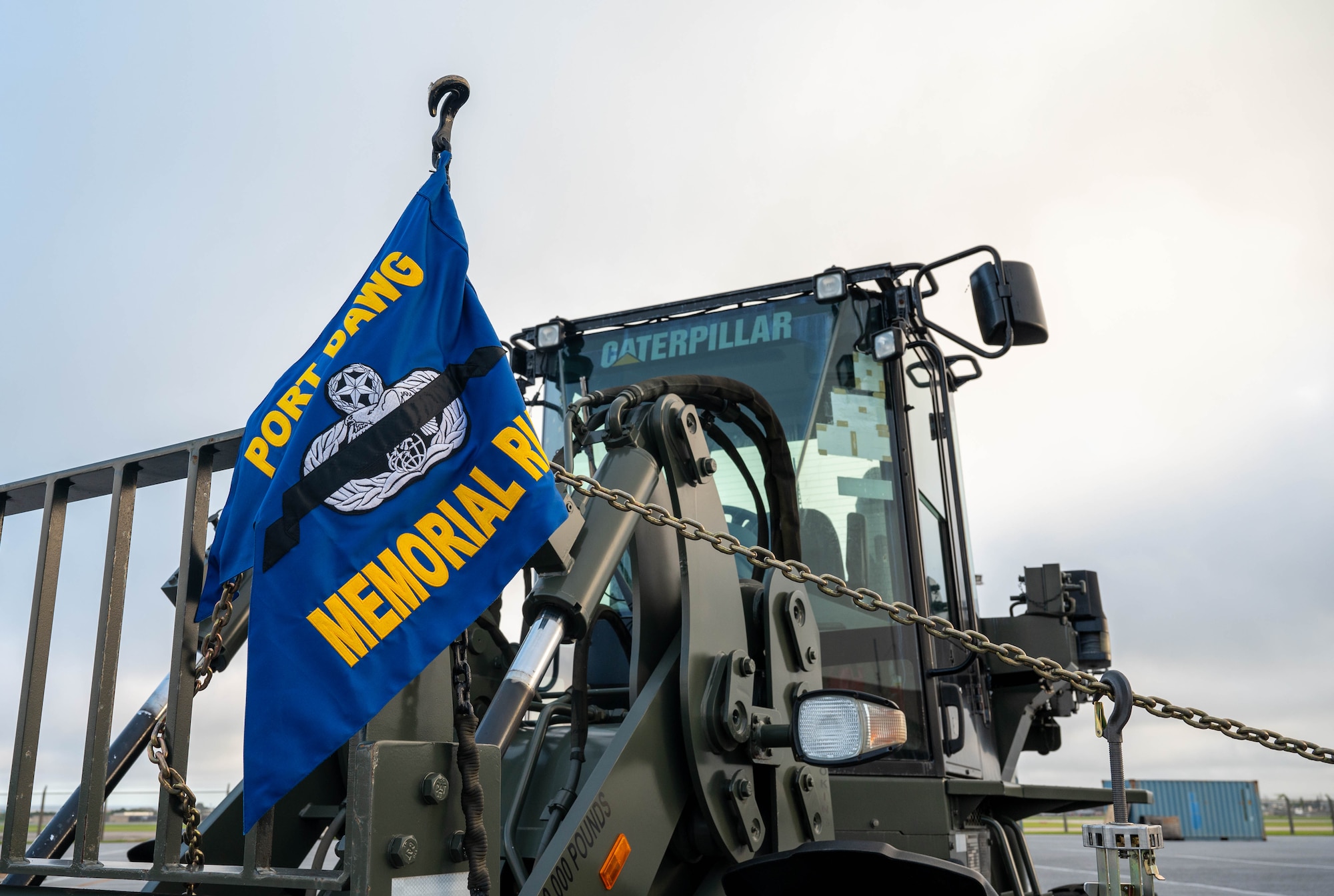 Flag leaning on forklift.