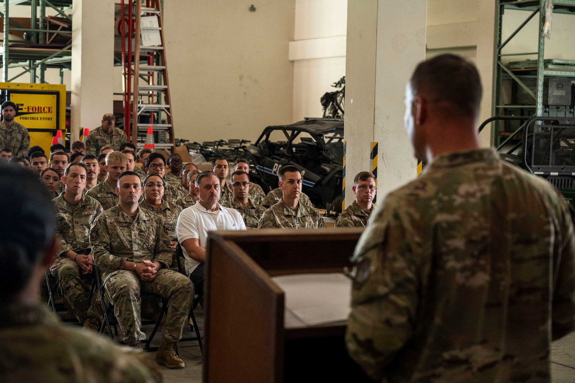 U.S. Air Force Chief Master Sgt. Brandon Wolfgang, 18th Wing command chief, addresses members of the 18th Security Forces Squadron during the police week closing ceremony