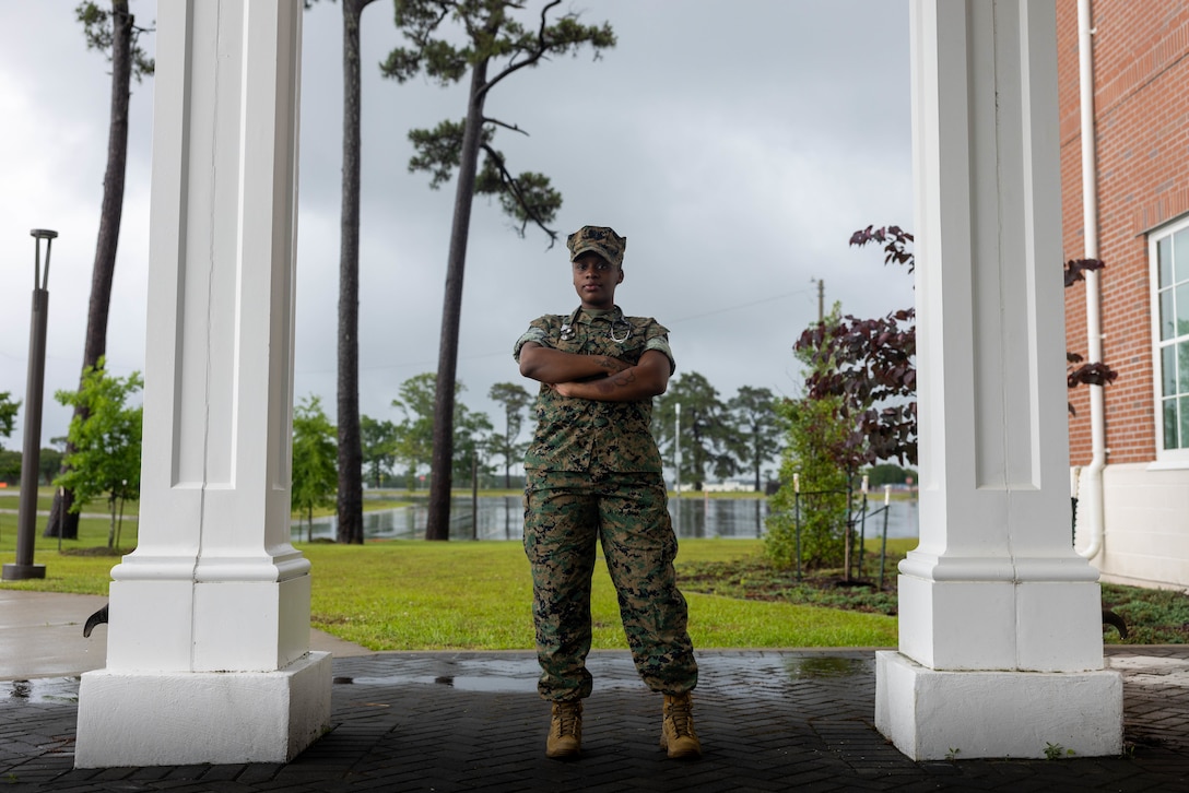 U.S. Navy Hospital Corpsman 3rd Class Niyona Gibbs, a dental technician with 2nd Dental Battalion, 2nd Marine Logistics Group, and a native of Bayboro, North Carolina, poses for a photo at Marine Corps Base Camp Lejeune, North Carolina, May 12, 2025. Gibbs was selected as the 2nd MLG Warrior of the Week by her leadership for her proficiency, maturity, and dedication to her job as a dental technician.  Her impact during exercise Joint Viking was remarkable where she assisted in the care of 200 patients and provided 75 hours of medical coverage during six training evolutions for the exercise. Each week, 2nd MLG recognizes one outstanding Marine or Sailor that goes above and beyond in their duties and embodies the qualities of an outstanding service member. (U.S. Marine Corps photo by Sgt. Alfonso Livrieri)