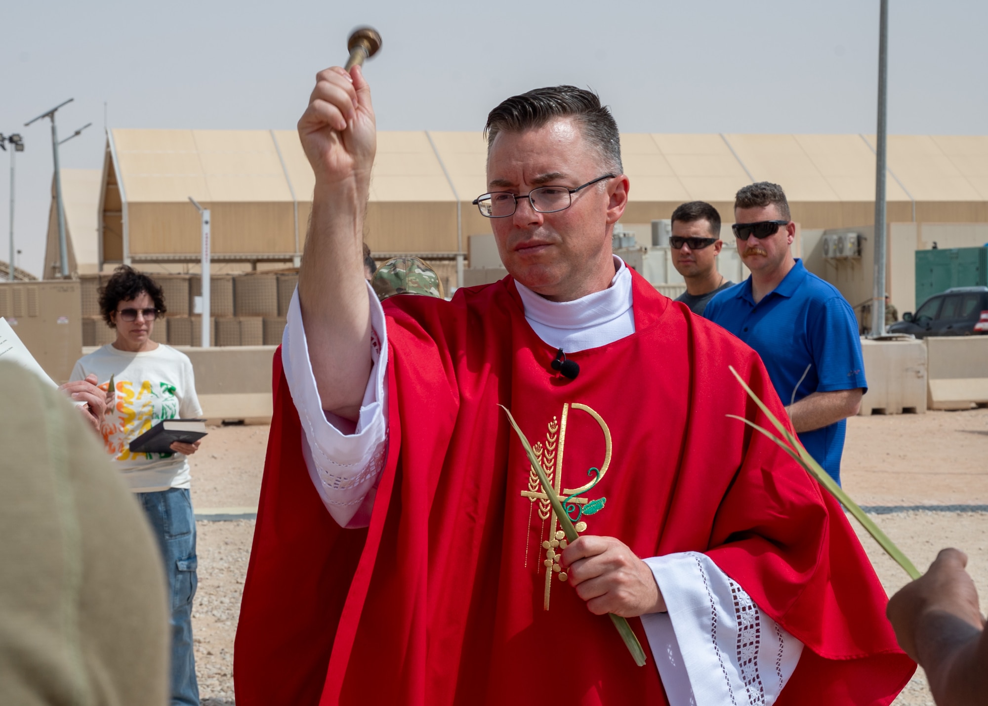 A Catholic Priest performs a blessing
