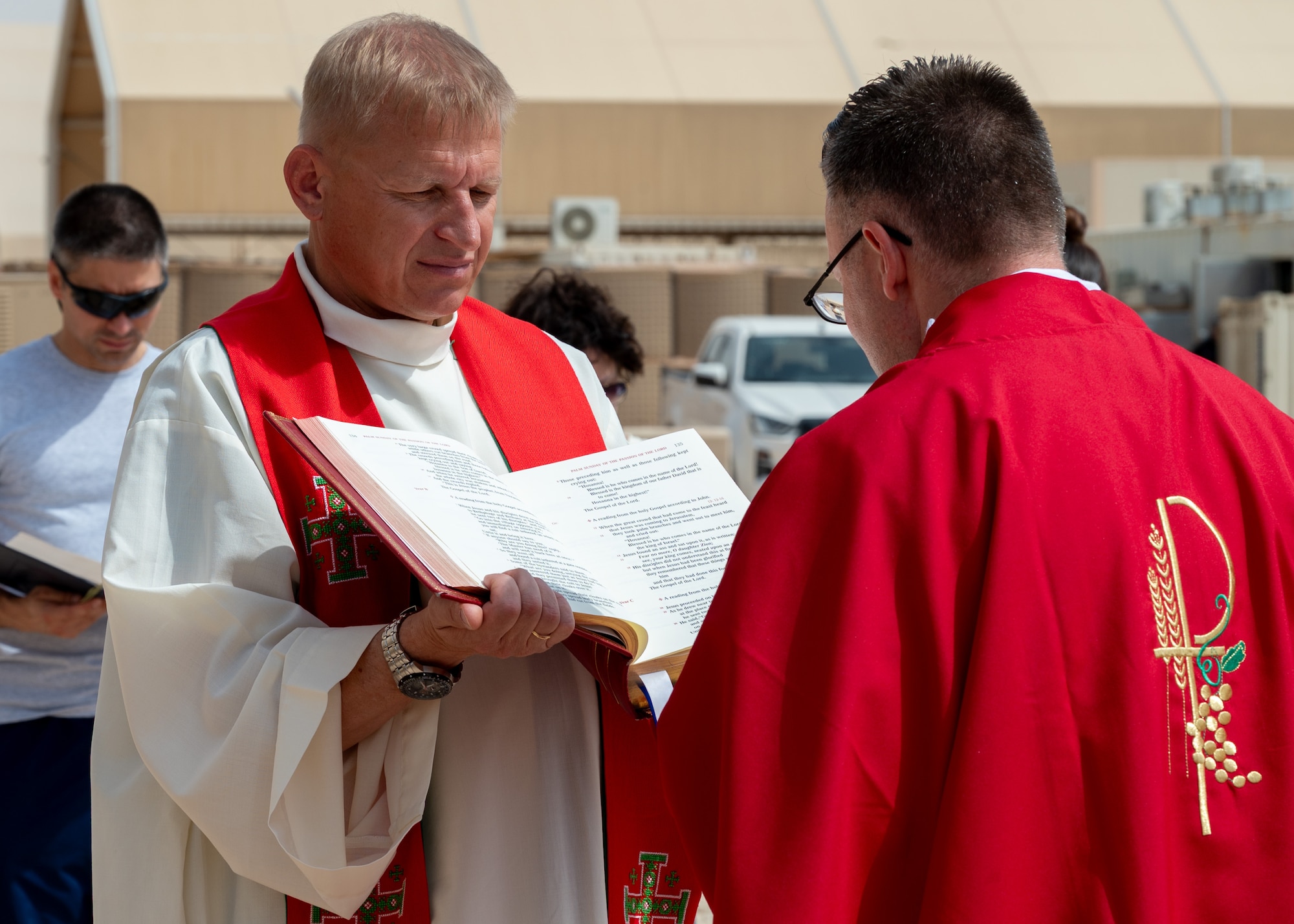 Two Catholic Priests read from a Roman Missal