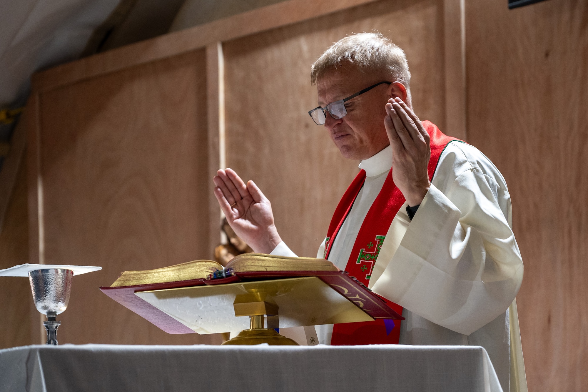 A Catholic Priest performs a sermon