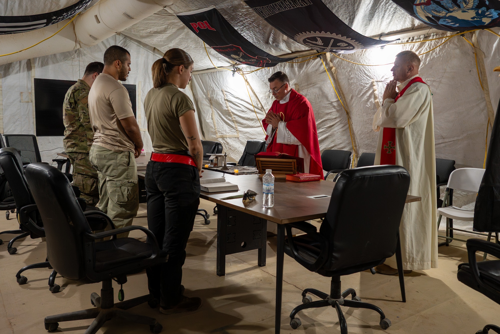 Airmen receive a Catholic service