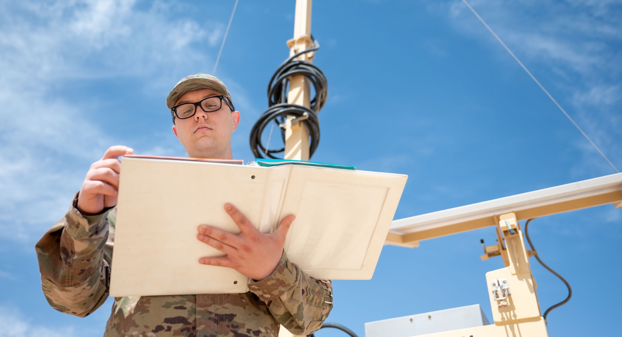 A man reads a binder.