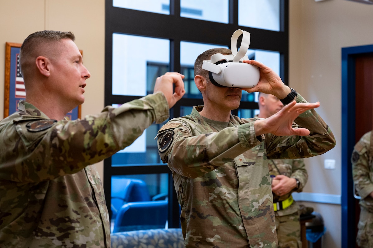 Brig. Gen. Stephen Snelson, U.S. Air Force Expeditionary Center commander, experiences a new virtual-reality training headset used by the 724th Air Mobility Squadron during a demonstration at Aviano Air Base, Italy, April 18, 2025. This interactive virtual training simulated a hands-on experience of common flightline tasks from the Airman's point of view. (U.S. Air Force photo by Staff Sgt. Brooke Wise)