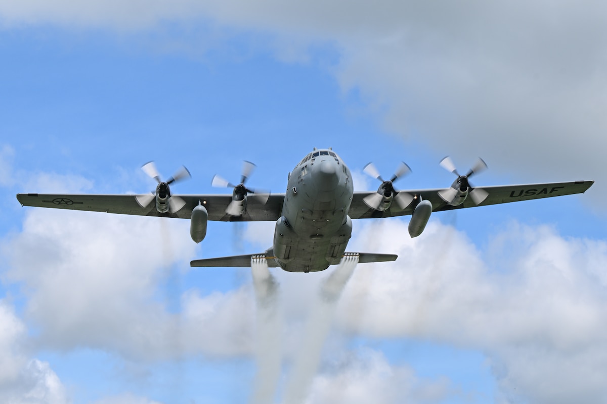 A 910th Airlift Wing C-130H Hercules aircraft, equipped with a training-only modular aerial spray system, flies near Youngstown Air Reserve Station, Ohio, May 7, 2025. The aircraft performed a larvicide application demonstration, using water, for a group of pest management specialists from across the Department of Defense attending an aerial spray application course. (U.S. Air Force photo by Eric M. White)