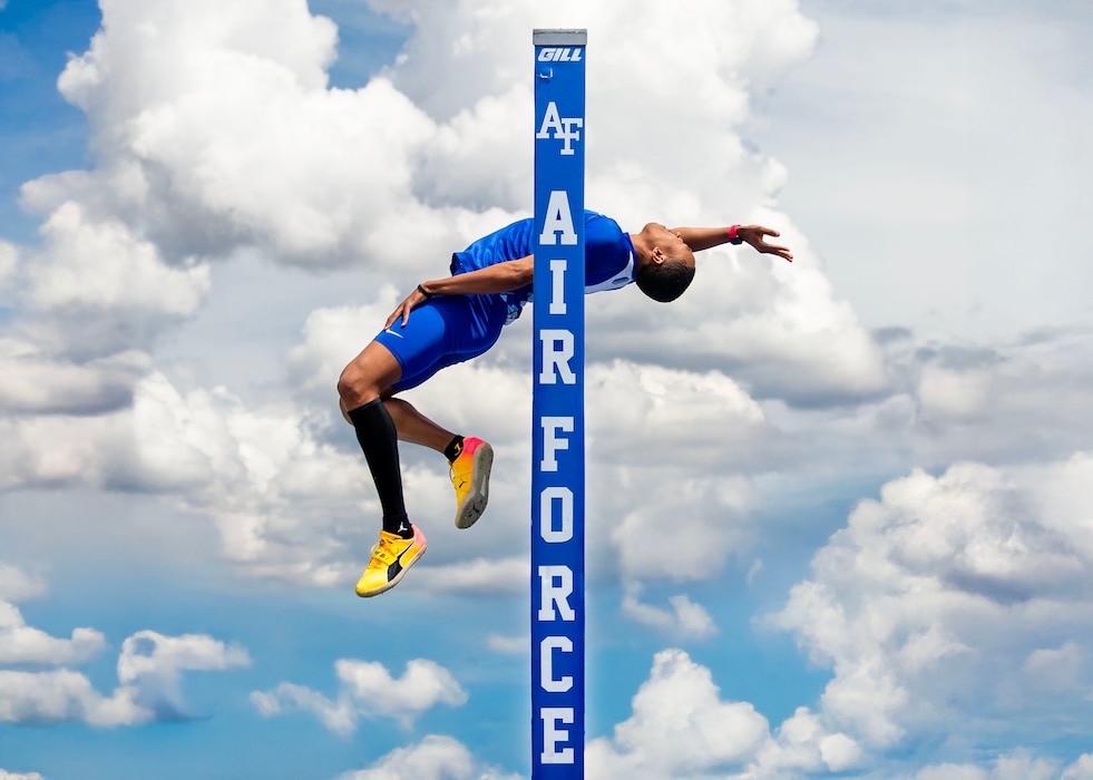 Airman performing a high jump