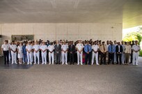 Distinguished visitors and exercise participants gather for a group photo at the closing ceremony of Obangame Express 2025. Obangame Express is one of three regional maritime exercises led by U.S. Sixth Fleet as part of a comprehensive strategy to provide collaborative opportunities to African forces and international partners to address maritime security concerns.