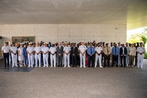 Distinguished visitors and exercise participants gather for a group photo at the closing ceremony of Obangame Express 2025. Obangame Express is one of three regional maritime exercises led by U.S. Sixth Fleet as part of a comprehensive strategy to provide collaborative opportunities to African forces and international partners to address maritime security concerns.