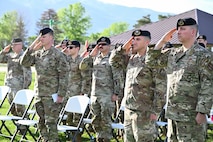 Several Airmen saluting