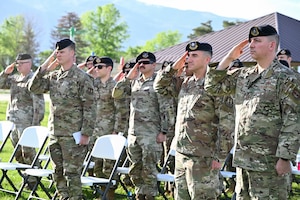 Several Airmen saluting