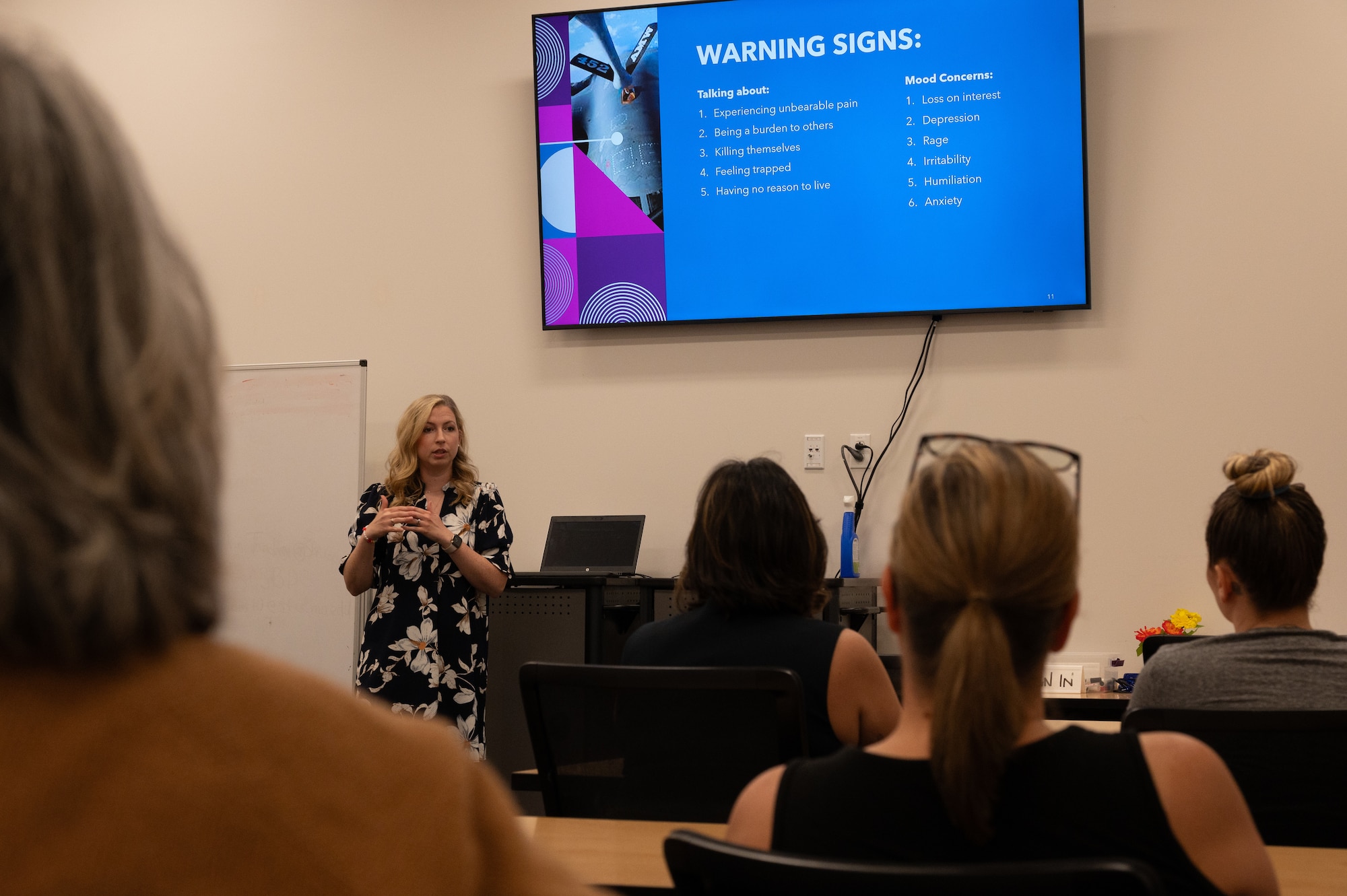 Chelsea Ecklebe, former True North program manager, speaks at a Spouses on Alert brief at Whiteman Air Force Base, Missouri, May 15, 2025.