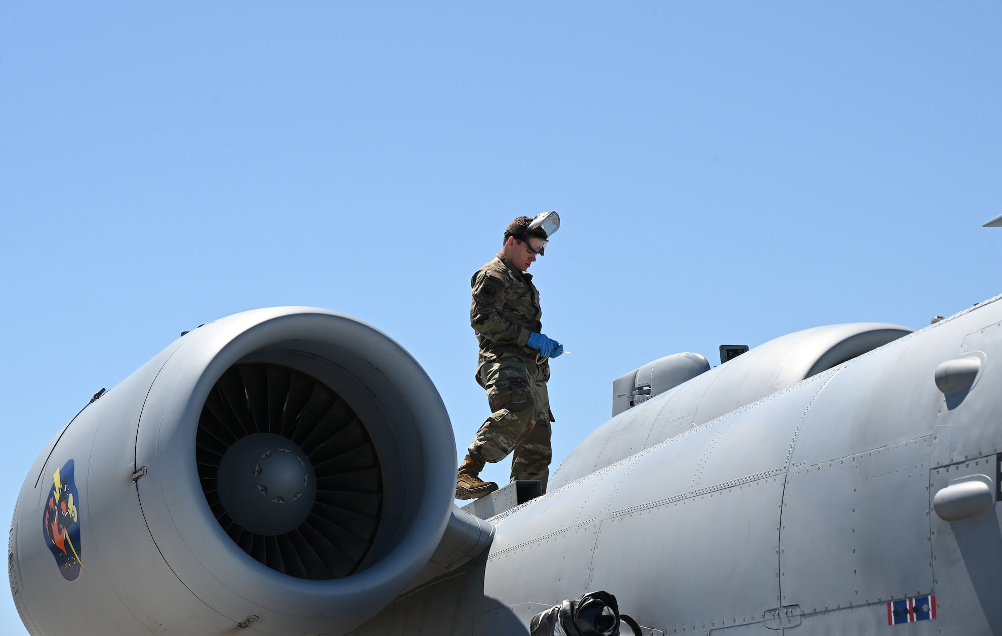 Maryland Air National Guard Airman 1st Class Braeden Bushyager, a crew chief assigned to the 175th Aircraft Maintenance Squadron, performs post-flight procedures on an A-10C Thunderbolt II aircraft during Combat Search and Rescue training at the Volk Field Combat Readiness Training Center, Wisconsin, May 8, 2025. Combat Search and Rescue, or CSAR, is one of the three primary functions of the A-10C Thunderbolt II, which also conducts close air support missions and airborne forward air control. (U.S. Air National Guard photo by Senior Master Sgt. Chris Schepers)