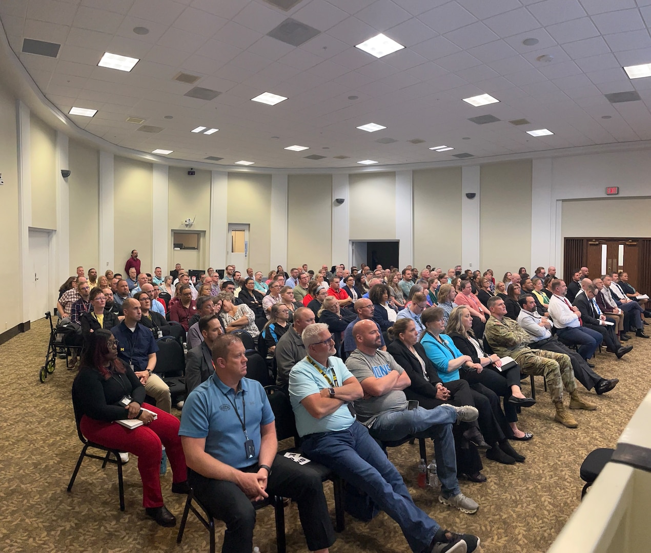 Employees at Defense Logistics Agency Disposition Services in Battle Creek, Michigan, view the Global Town Hall remotely May 14, 2025. Photo by Jeffrey Landenberger