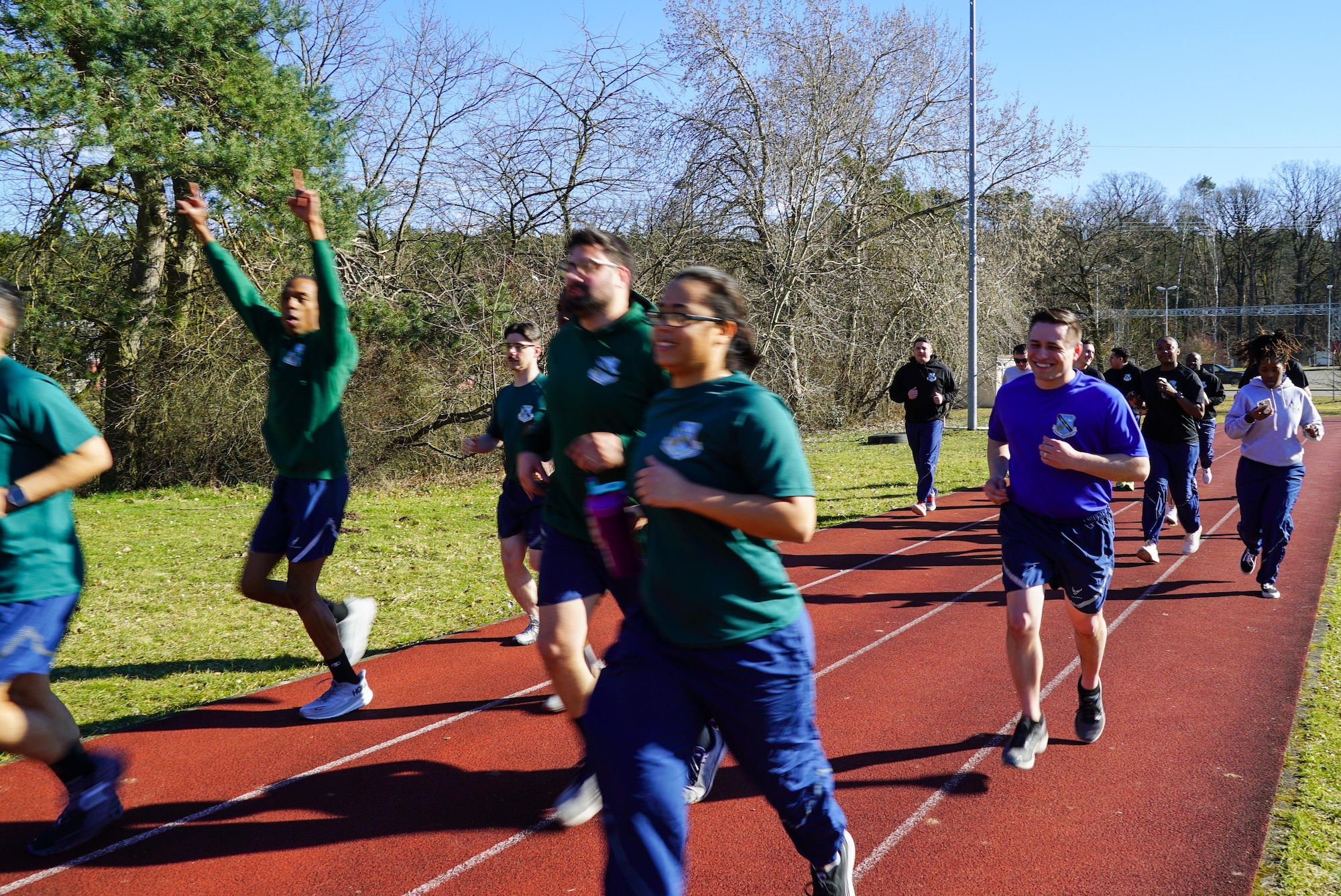 Students run during a group physical training session