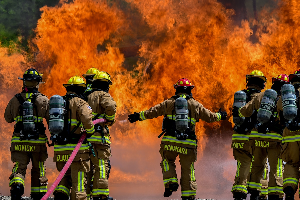 Firefighters from the 121st Air Refueling Wing at Rickenbacker Air National Guard Base, Ohio, respond to a fire aboard an aircraft fire simulator at Youngstown Air Reserve Station, Ohio, May 14, 2025.