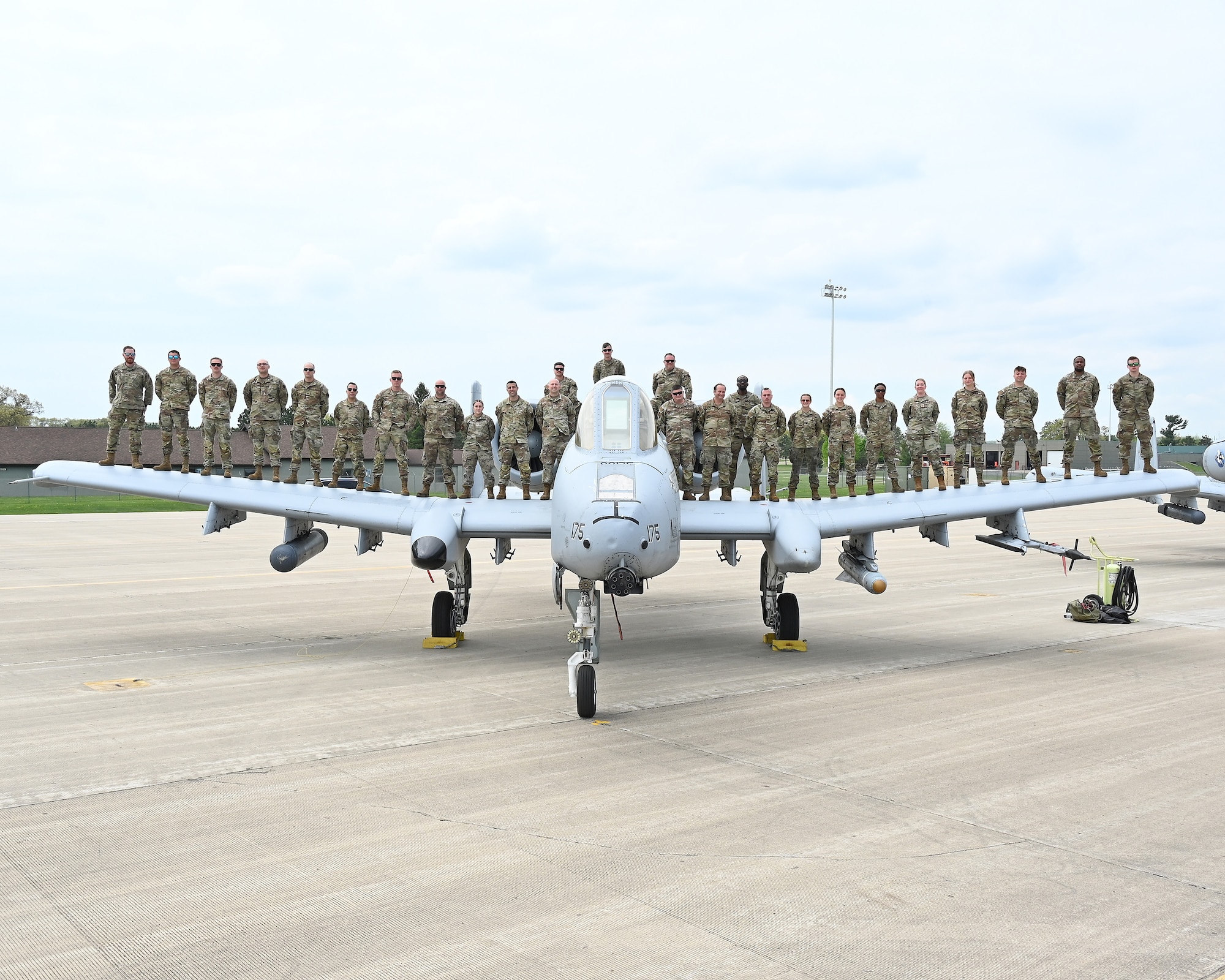 Airmen assigned to the 175th Maintenance Group pose for a group photograph during Combat Search and Rescue training at the Volk Field Combat Readiness Training Center, Wisconsin, May 13, 2025. Combat Search and Rescue, or CSAR, is one of the three primary functions of the A-10C Thunderbolt II, which also conducts close air support missions and airborne forward air control. (U.S. Air National Guard photo by Senior Master Sgt. Chris Schepers)