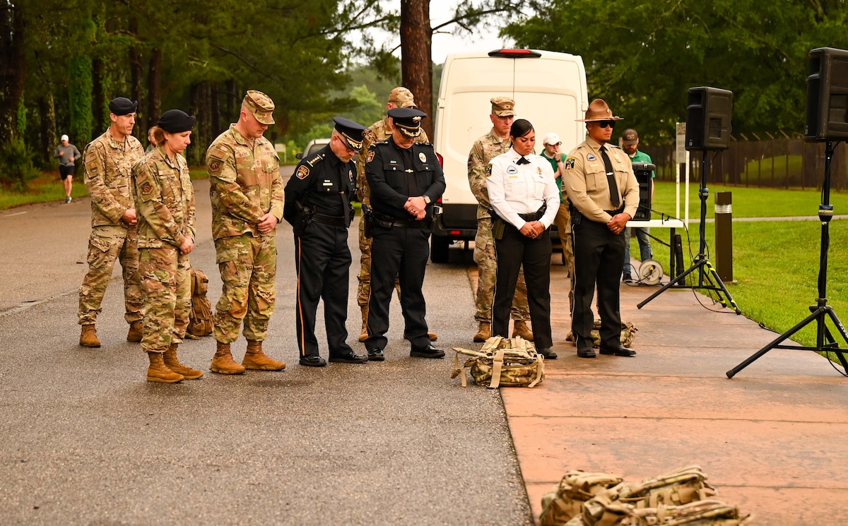 U.S. Airmen from Maxwell Air Force and Montgomery police officers gather for the opening statement of the Fallen Warrior Ruck at Maxwell Air Force Base, Alabama, May 12, 2025.