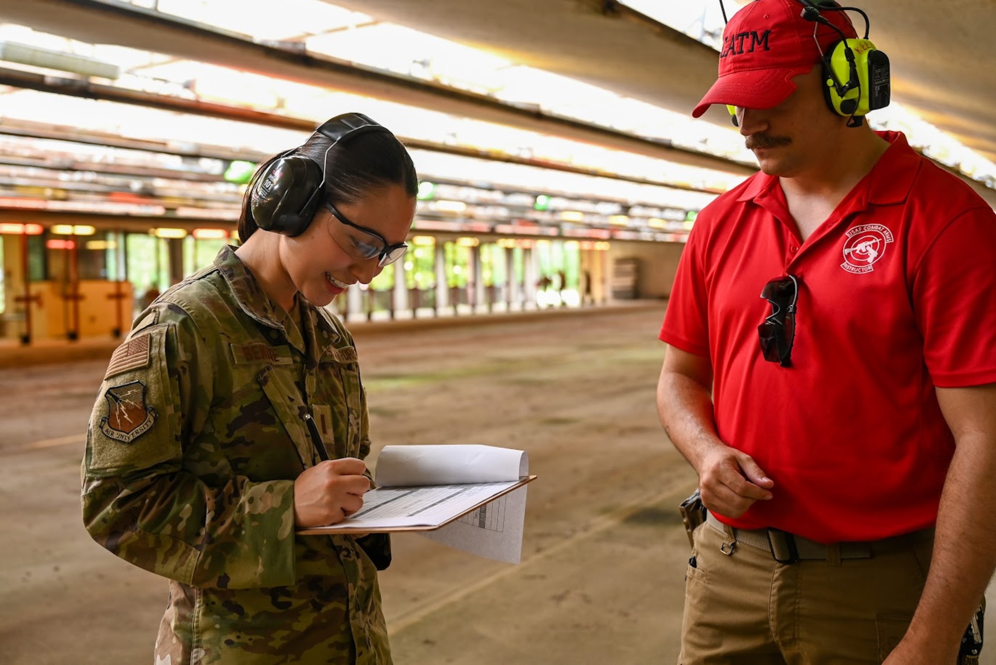 U.S. Air National Guard Senior Airman Emily Weidner, 377th Fighter Squadron sheet metal technician, fires an M18 at Maxwell Air Force Base, Alabama, May 16, 2025.