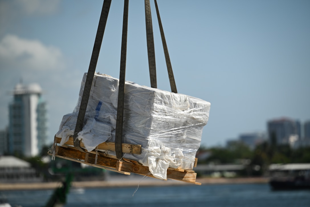Bales of illegal narcotics are offloaded by crew members of U.S. Coast Guard Cutter Calhoun (WMSL 759) in Port Everglades, May 16, 2025. Calhoun’s crew offloaded more than 19,055 pounds of cocaine and marijuana valued at approximately $140.9 million in Port Everglades, May 16, 2025. (Coast Guard photo by Petty Officer 3rd Class Jessica Walker)