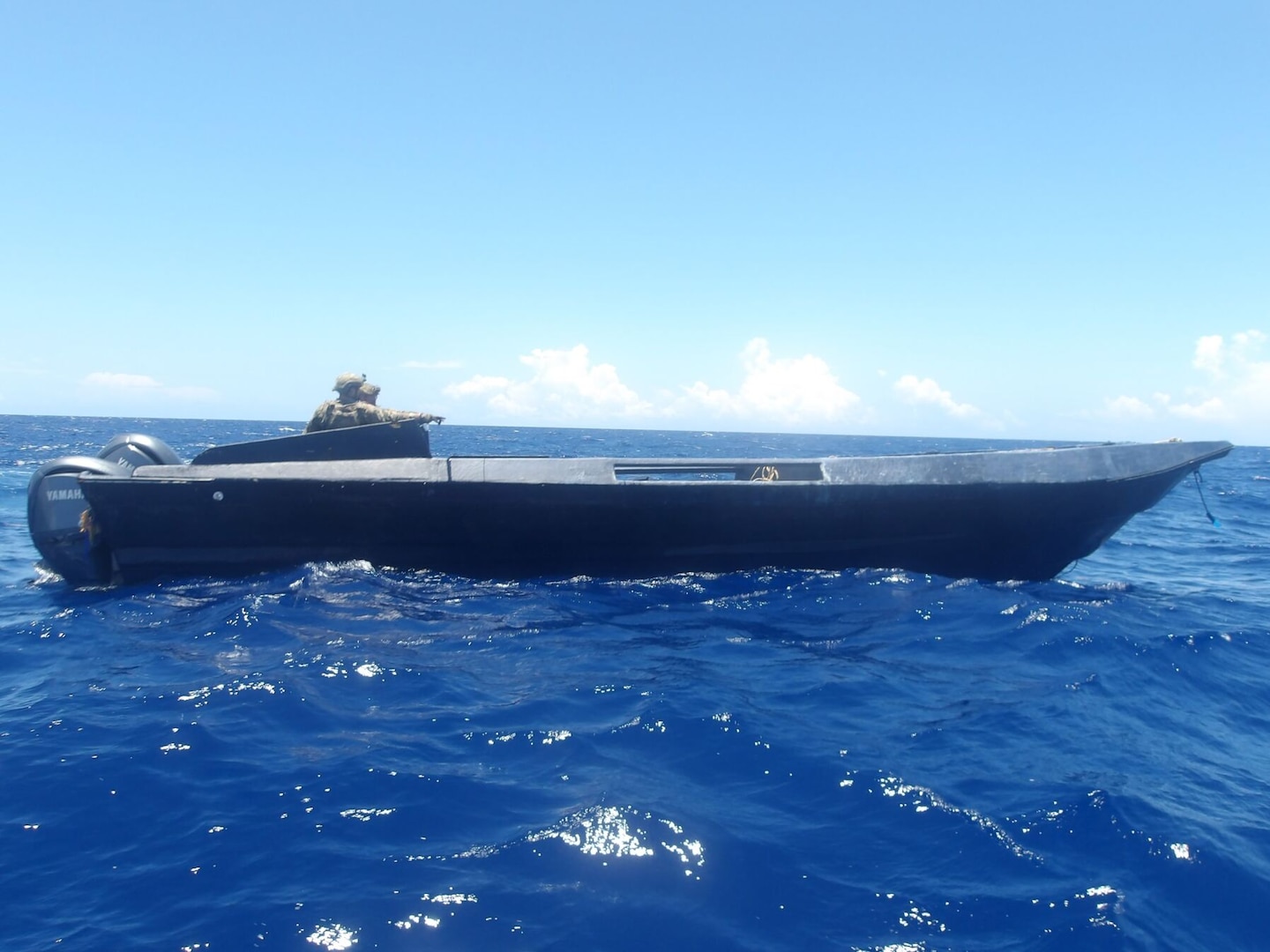 Law enforcement boat crew members assigned to U.S. Coast Guard Cutter Calhoun (WMSL 759) interdict a low-profile vessel suspected of drug smuggling in the Caribbean Sea, May 7, 2025. Calhoun’s crew offloaded more than 19,055 pounds of cocaine and marijuana valued at approximately $140.9 million in Port Everglades, May 16, 2025. (U.S. Coast Guard photo)