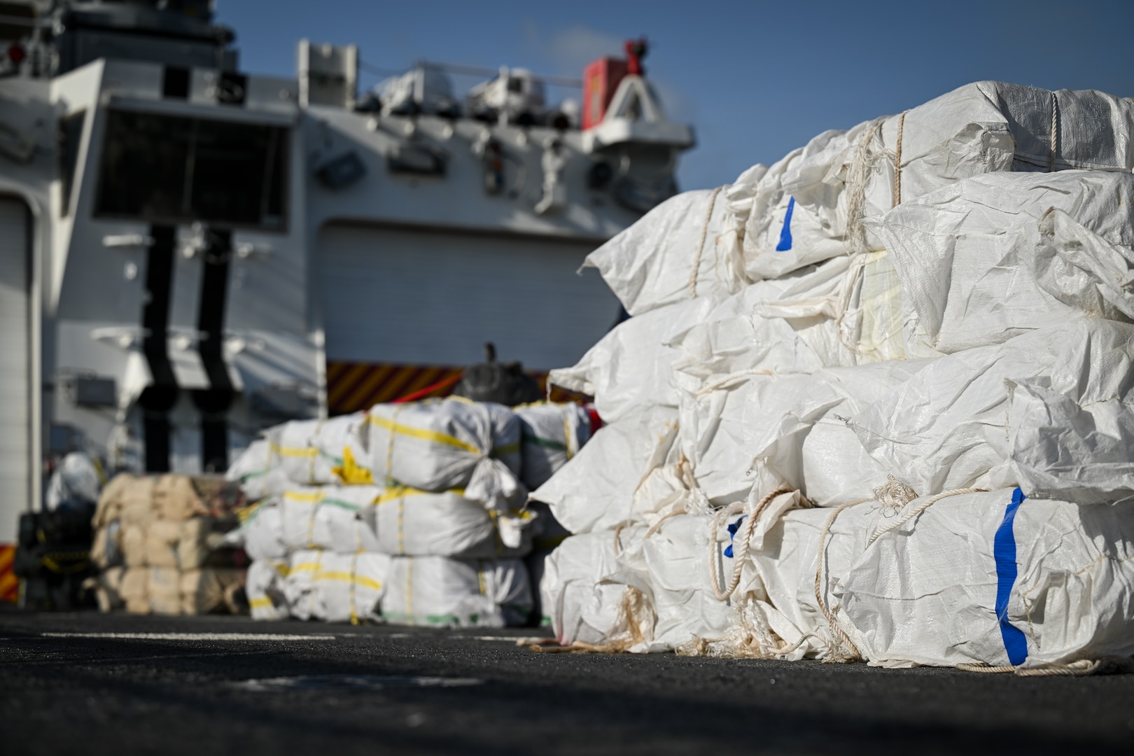 Bales of illegal narcotics are offloaded by crew members of U.S. Coast Guard Cutter Calhoun (WMSL 759) in Port Everglades, May 16, 2025. Calhoun’s crew offloaded more than 19,055 pounds of cocaine and marijuana valued at approximately $140.9 million in Port Everglades, May 16, 2025. (Coast Guard photo by Petty Officer 3rd Class Jessica Walker)
