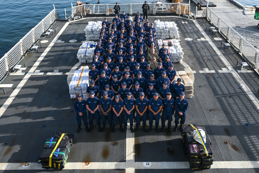 Crew members aboard U.S. Coast Guard Cutter Calhoun (WMSL 759) pose before preparing to offload pallets of illegal narcotics in Port Everglades, May 16, 2025. Calhoun’s crew offloaded more than 19,055 pounds of cocaine and marijuana valued at approximately $140.9 million in Port Everglades, May 16, 2025. (Coast Guard photo by Petty Officer 3rd Class Jessica Walker)