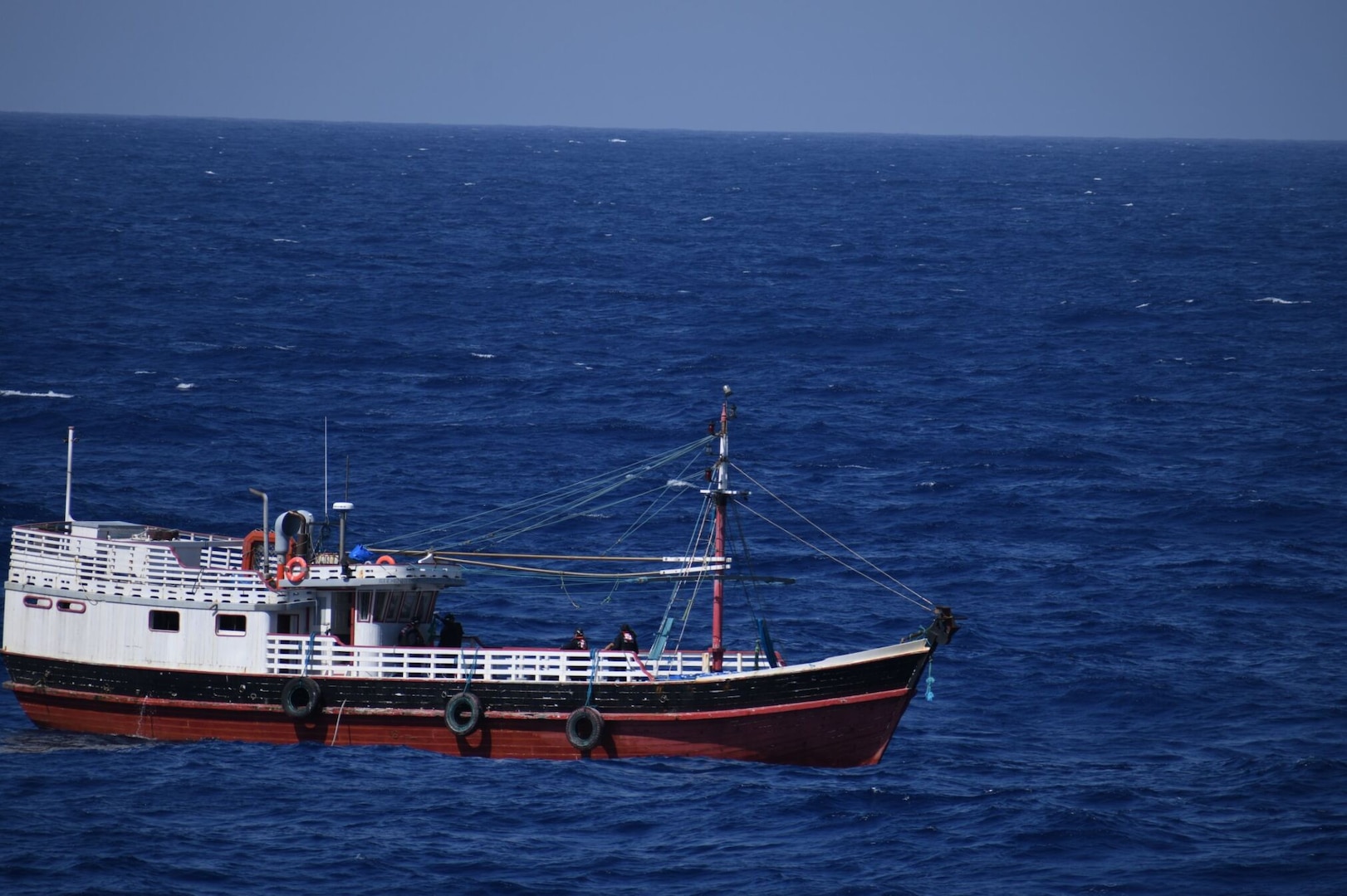 Law enforcement crew members aboard U.S. Coast Guard Cutter Calhoun (WMSL 759) conduct a boarding on a fishing vessel suspected of drug smuggling approximately 1,200 miles west of Las Palmas, Canary Islands, April 12, 2025. Calhoun’s crew offloaded approximately 19,055 pounds of cocaine and marijuana, worth an estimated $140.9 million, at Port Everglades, May 16, 2025. (U.S. Coast Guard photo)