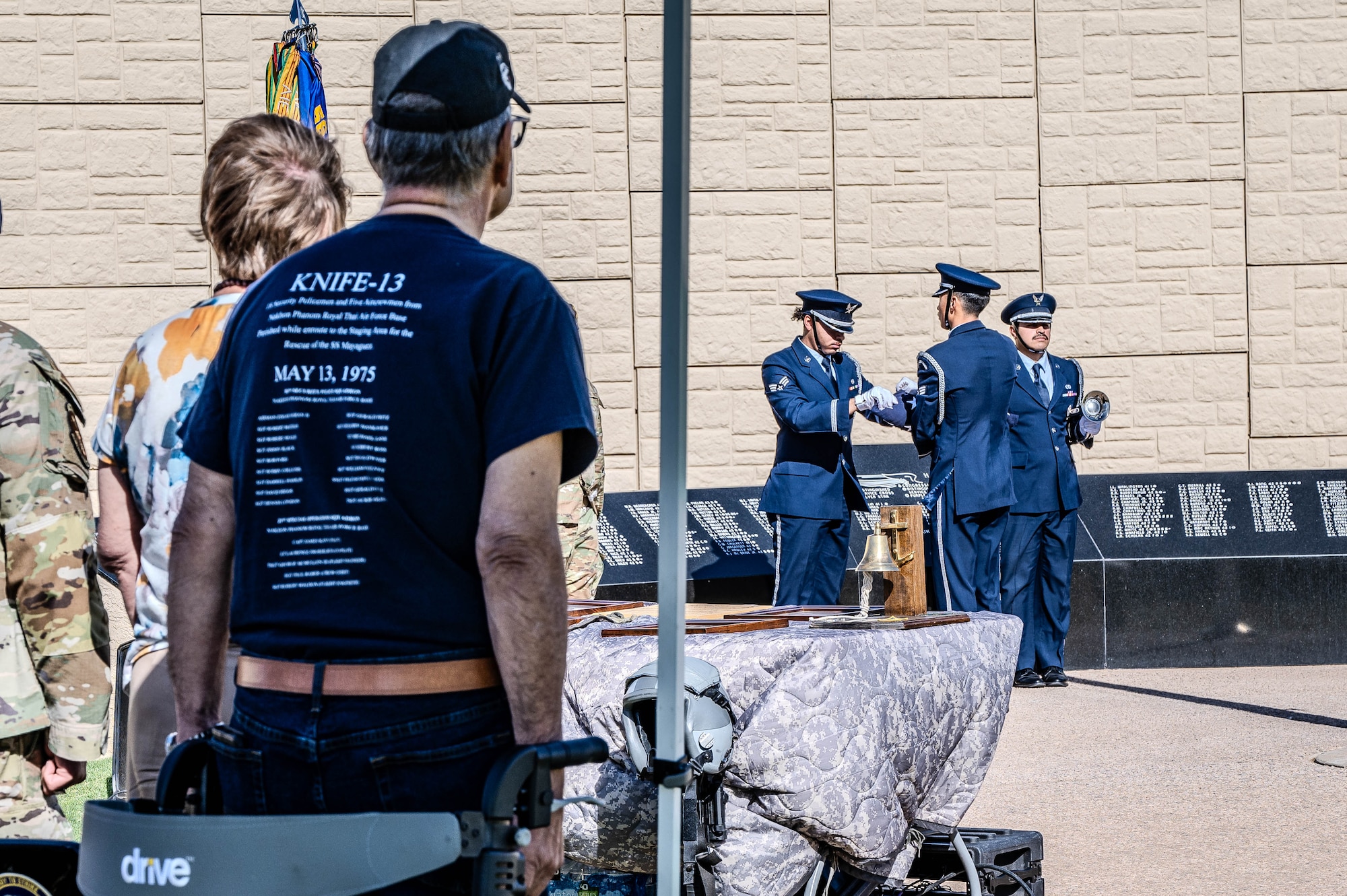U.S. Air Force honor guardsmen assigned to the 56th Fighter Wing, carefully fold the U.S. flag during a POW/MIA retreat ceremony