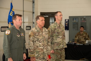 Photo of from left, U.S. Air Force Col. Benjamin Robbins, 177th Fighter Wing commander, Lt. Col. Daniel Roske, 227th Air Support Operations Squadron (ASOS) commander, and Chief Master Sgt. Patrick Donohoe, 227th ASOS superintendent, stands at the position of attention during a Casing of the Colors and Bronze Star Medal award ceremony at the 177 FW, Egg Harbor Township, New Jersey, May 4, 2025. The Casing of the Colors Ceremony marks a transition of a unit, whether that be inactivation, relocation, or deployment. The Bronze Star is awarded to service members who distinguish themselves by heroic or meritorious achievement or service in a combat zone.