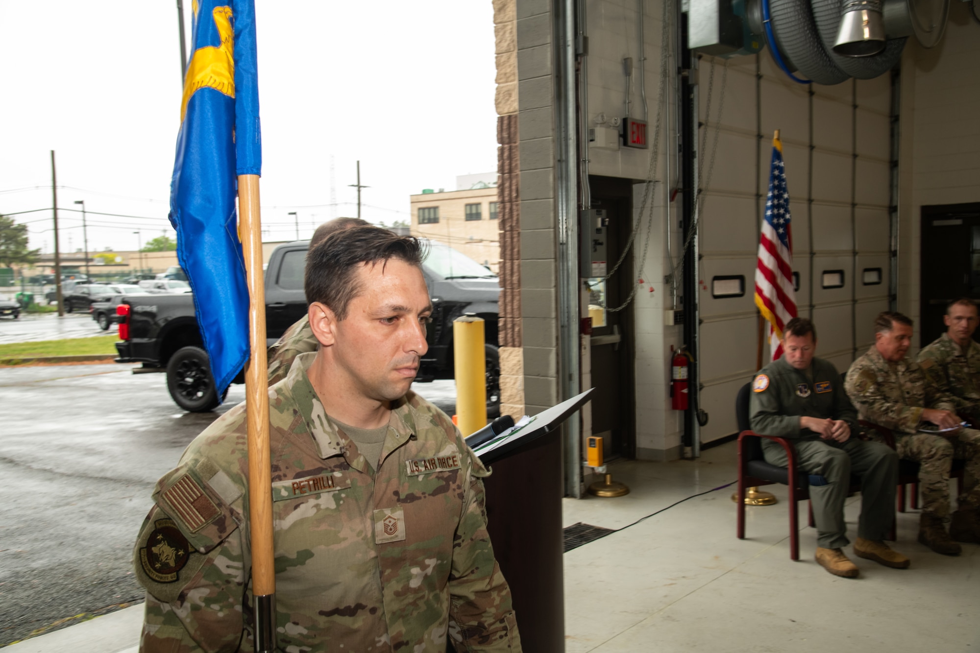 Photo of U.S. Air Force Master Sgt. Victor Petrilli, 227th Air Support Operations Squadron first sergeant, holds the guidon during a Casing of the Colors and Bronze Star Medal award ceremony at the 177 FW, Egg Harbor Township, New Jersey, May 4, 2025. The Casing of the Colors Ceremony marks a transition of a unit, whether that be inactivation, relocation, or deployment. The Bronze Star is awarded to service members who distinguish themselves by heroic or meritorious achievement or service in a combat zone.
