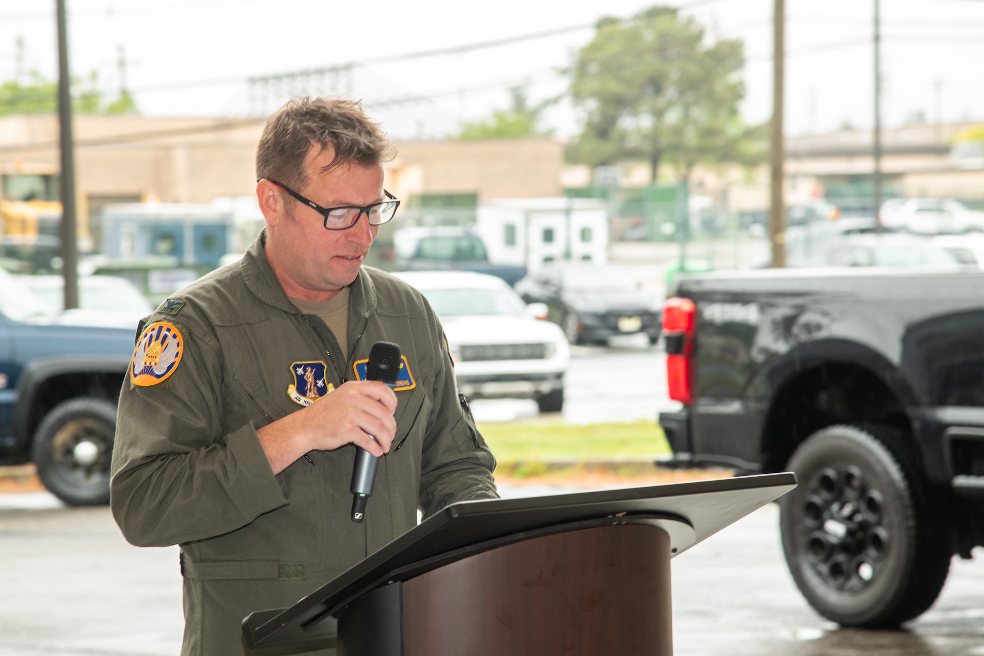 A photo of U.S. Air Force Col. Benjamin Robbins, commander of the 177th Fighter Wing, gives a speech at a Casing of the Colors and Bronze Star Medal award ceremony at the 177 FW, Egg Harbor Township, New Jersey, May 4, 2025. The Casing of the Colors Ceremony marks a transition of a unit, whether that be inactivation, relocation, or deployment. The Bronze Star is awarded to service members who distinguish themselves by heroic or meritorious achievement or service in a combat zone.