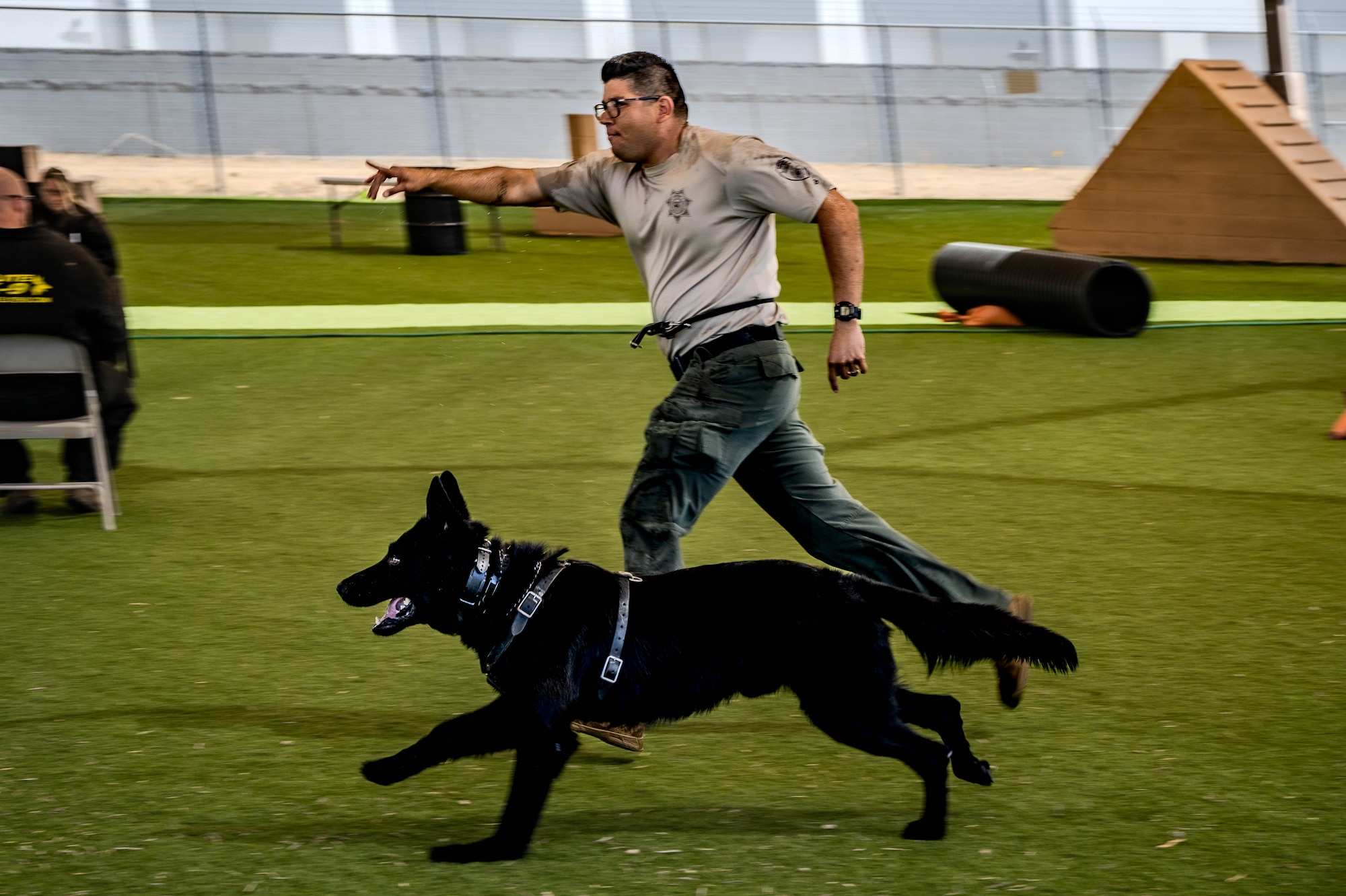 Christian Corrales, Arizona Department of Corrections dog handler, and his K-9 partner, Dag, compete in a K-9 event