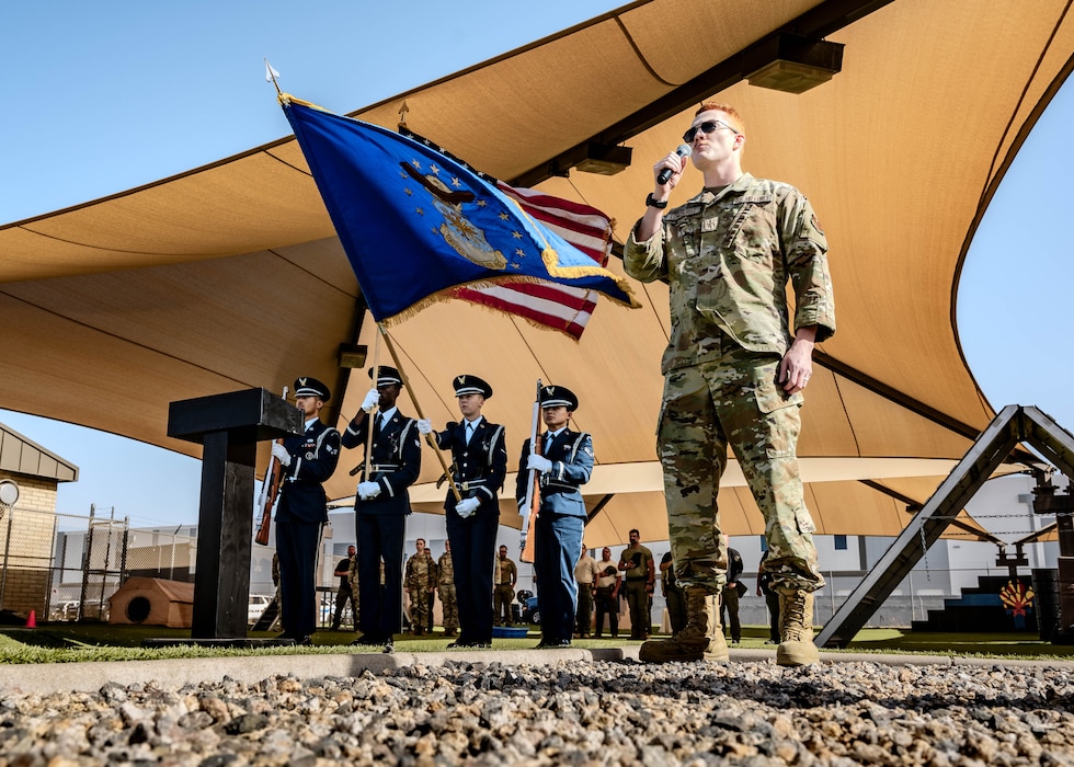 U.S. Air Force Airman 1st Class Joseph Longhurst, 56th Logistics Readiness Squadron mission generating vehicle equipment maintenance apprentice, and honor guardsmen assigned to the 56th Fighter Wing, present the colors and perform at a K-9 Competition