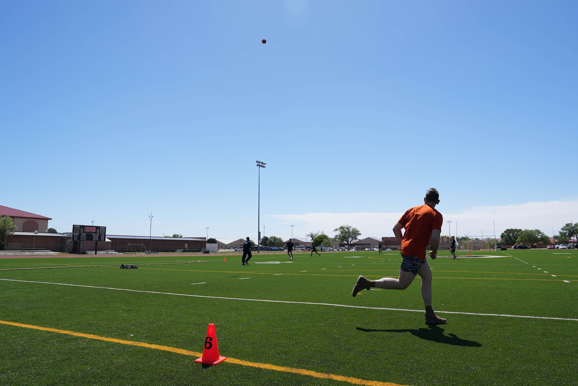 An Airman assigned to the 27th Special Operations Wing admires his home run during Battle of the Badges at Cannon Air Force Base, New Mexico, May 13, 2025. Battle of the Badges allows for a friendly competition between squadrons across the wing, enhancing their physical capabilities while building relationships between Airmen from different career fields. (U.S. Air Force photo by Staff Sgt. Kevin Williams)