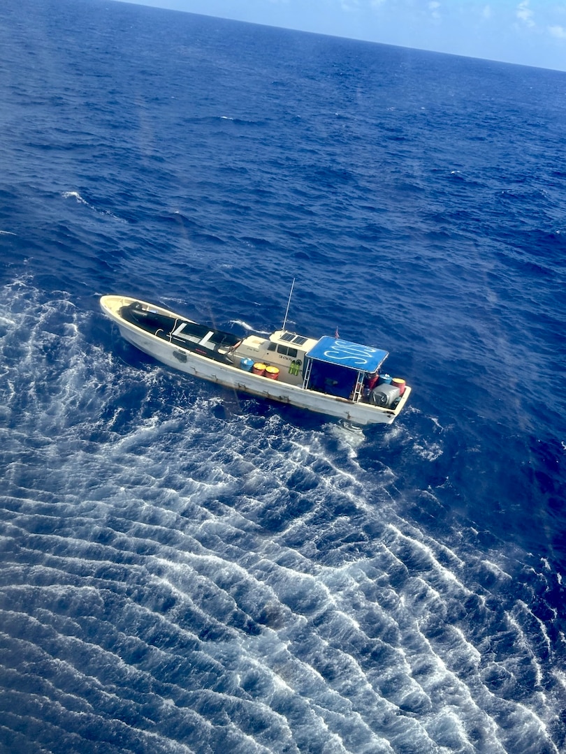 An MH-60 Knighthawk helicopter crew from U.S. Navy Helicopter Sea Combat Squadron 25 makes contact with mariners from the 47-foot motor vessel Lucky Harvest around 9:30 a.m., around 125 nautical miles west of Guam on May 16, 2025, before hoisting one mariner. A U.S. Coast Guard HC-130 Hercules airplane crew from Air Station Barbers Point in Hawai’i remained on scene with the vessel until the USCGC Myrtle Hazard (WPC 1139) arrived, rescued the second mariner, and took the vessel safely in tow, headed to Guam. (U.S. Naphoto)