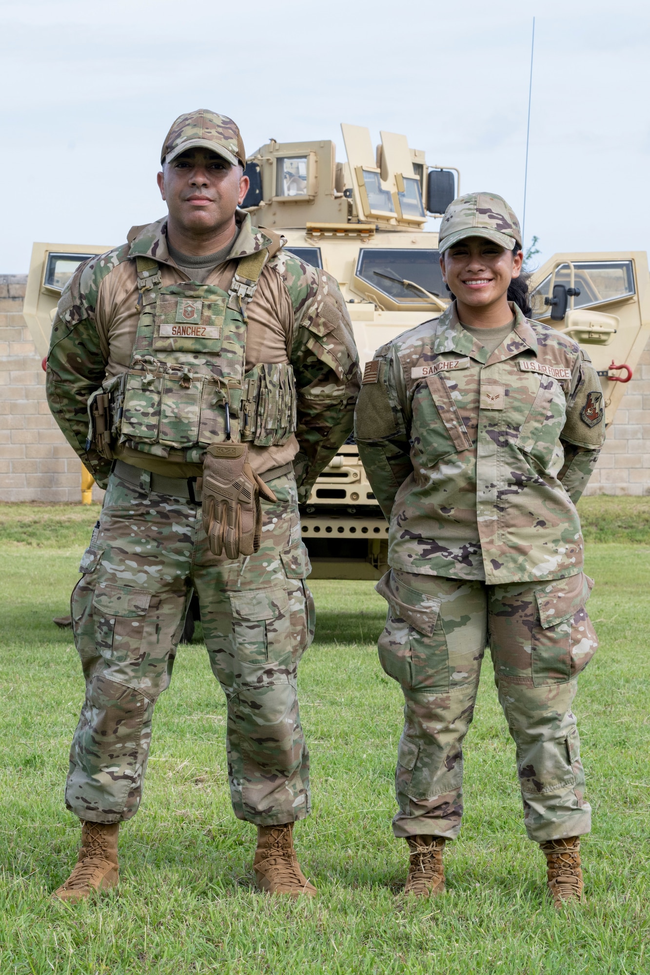 U.S. Air Force Master Sgt. José Sanchez, an emergency manager, assigned to the 129th Rescue Wing, California Air National Guard, and Airman 1st Class Ariadna Sanchez, an aerospace medical service specialist assigned to the 156th Medical Group Detachment 1, Chemical, Biological, Radiological, Nuclear and high-yield Explosives Enhanced Response Force Package (CERFP), Puerto Rico Air National Guard, pose for an environmental portrait during the 2025 Virgin Islands and Puerto Rico emergency management Deployment for Training at Camp Santiago Joint Maneuver Training Center, Salinas, Puerto Rico, May 15, 2025. The 2025 VIPR DFT measured multiple ANG civil engineer squadrons’ mission readiness by simulating an austere location to prepare participating Airmen to execute the Agile Combat Employment Concept in the U.S. Air Force Indo-Pacific Command area of responsibility. (U.S. Air National Guard photo by Senior Airman Victoria A. Jewett)