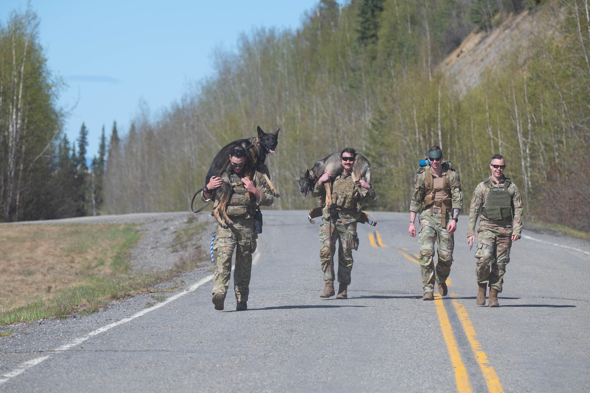 U.S. Air Force Airmen assigned to the 354th Fighter Wing run during a memorial ruck for Police Week at Eielson Air Force Base, Alaska, May 14, 2025.