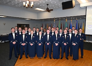 The first graduating class from the Future Undergraduate Pilot Training model pose for a group photo before the start of the official graduation ceremony.