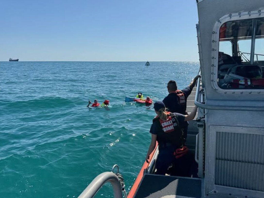 A Coast Guard Station St. Petersburg boat crew rescued three boaters, Friday, after their 29-foot boat capsized approximately six miles west of Bunces Pass.